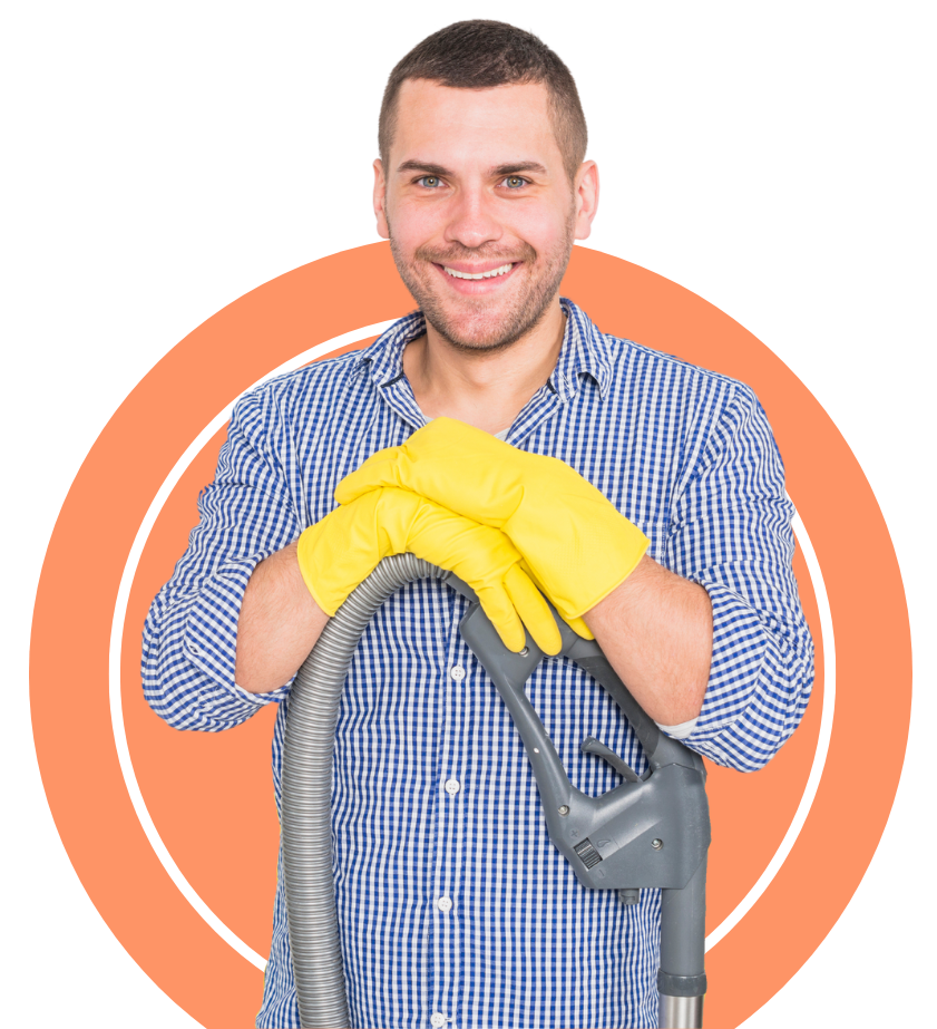 A carpet cleaner is holding a vaccum and smiling